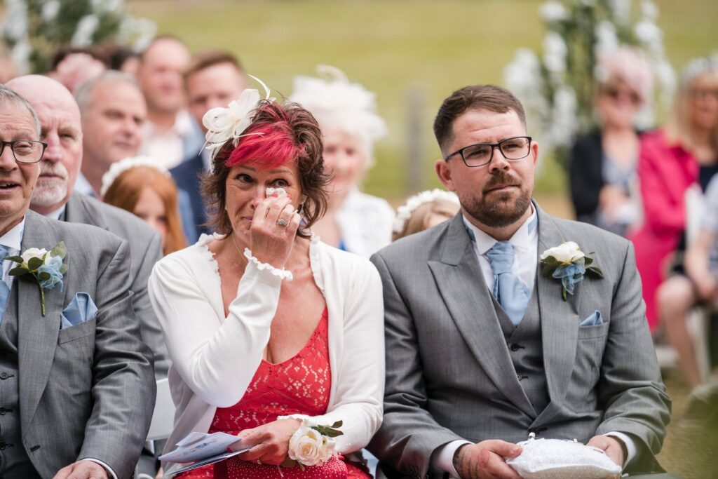 68 tearful mother of groom ihg hotel outdoor ceremony sandford oxford oxfordshire wedding photography