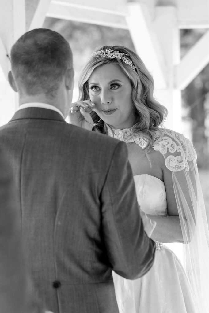 70 bride wipes tear outdoor marriage ceremon ihg hotel sandford oxford oxfordshire wedding photographers