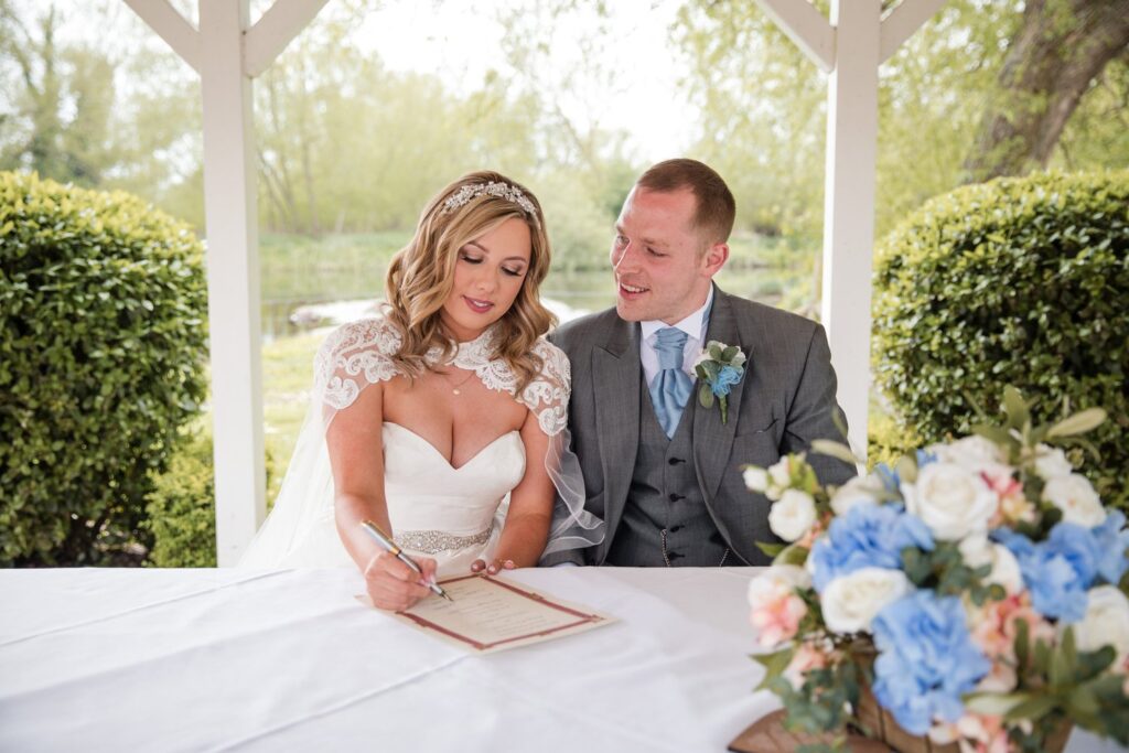 79 bride signs marriage register ihg hotel sandford oxford oxfordshire wedding photographers
