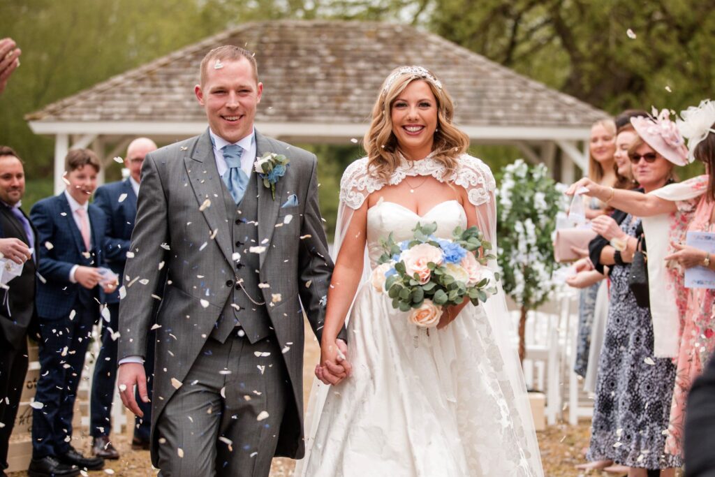 85 smiling bride groom enjoy confetti parade ihg hotel sandford oxford oxfordshire wedding photographers