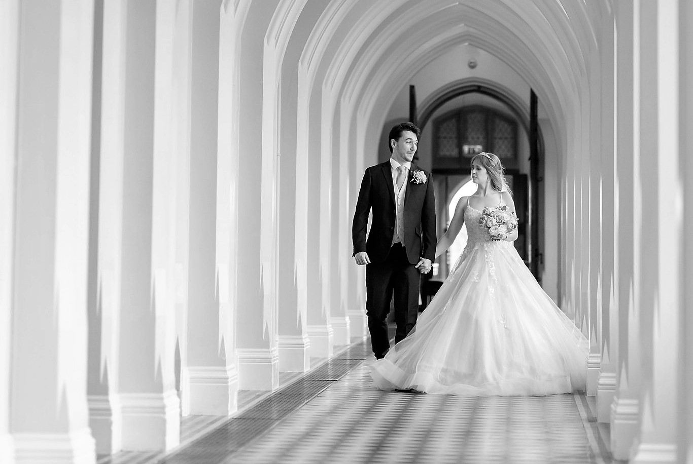 102 bride groom stroll corridor holding hands callow end worcester oxford wedding photographers