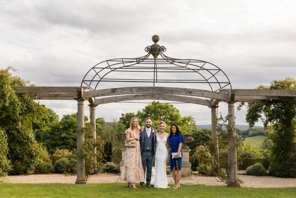 107 bride groom guests euridge manor garden pergola chippenham wiltshire oxford wedding photographer
