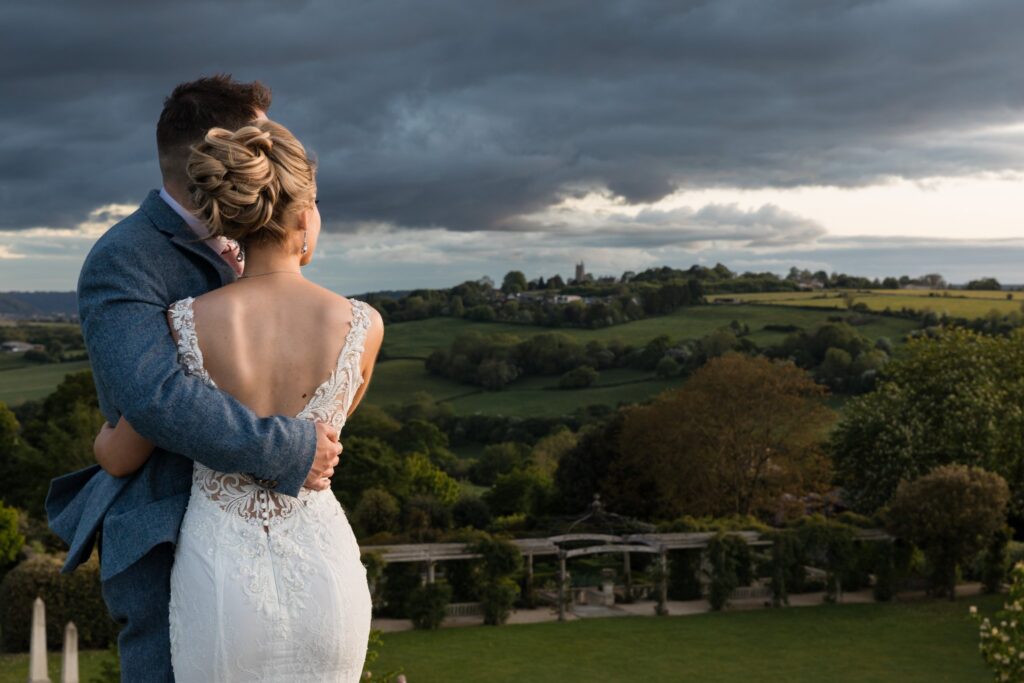 133 bride groom embrace watching sunset euridge manor grounds chippenham wiltshire oxford wedding photography