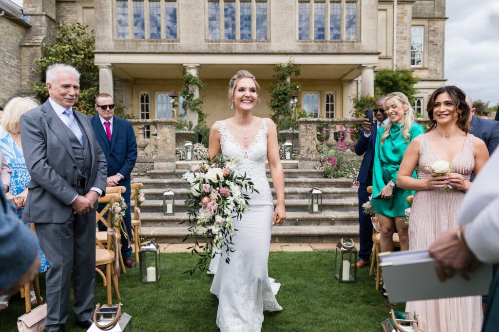 47 guests watch bride enter outdoor ceremony euridge manor chippenham wiltshire oxford wedding photographer
