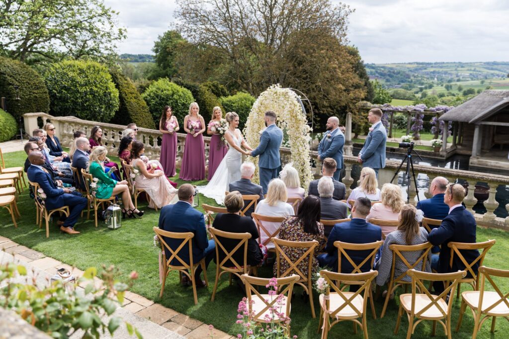 48 bride groom hold hands euridge manor outdoor ceremony chippenham wiltshire oxford wedding photographers