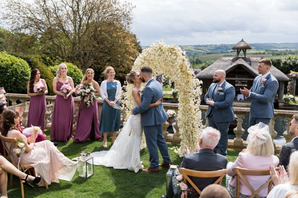 58 bride grooms first kiss outdoor ceremony euridge manor chippenham wiltshire oxfordshire wedding photography