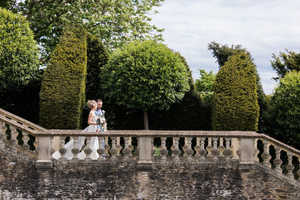 61 bride groom descend terrace stairs euridge manor chippenham wiltshire oxford wedding photography