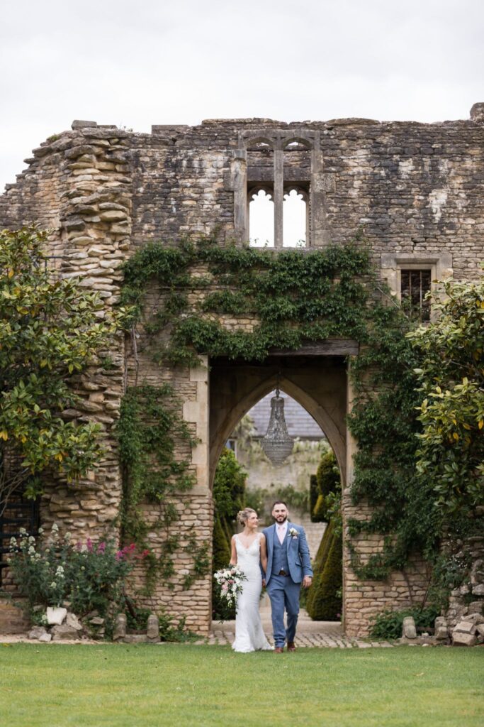 72 bride groom stroll holding hands euridge manor gardens chippenham wiltshire oxford wedding photographers