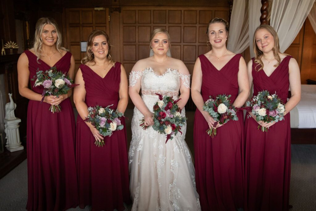 07 bride bridesmaids hold bouquets rushpool hall saltburn-by-the-sea oxfordshire wedding photographerrs
