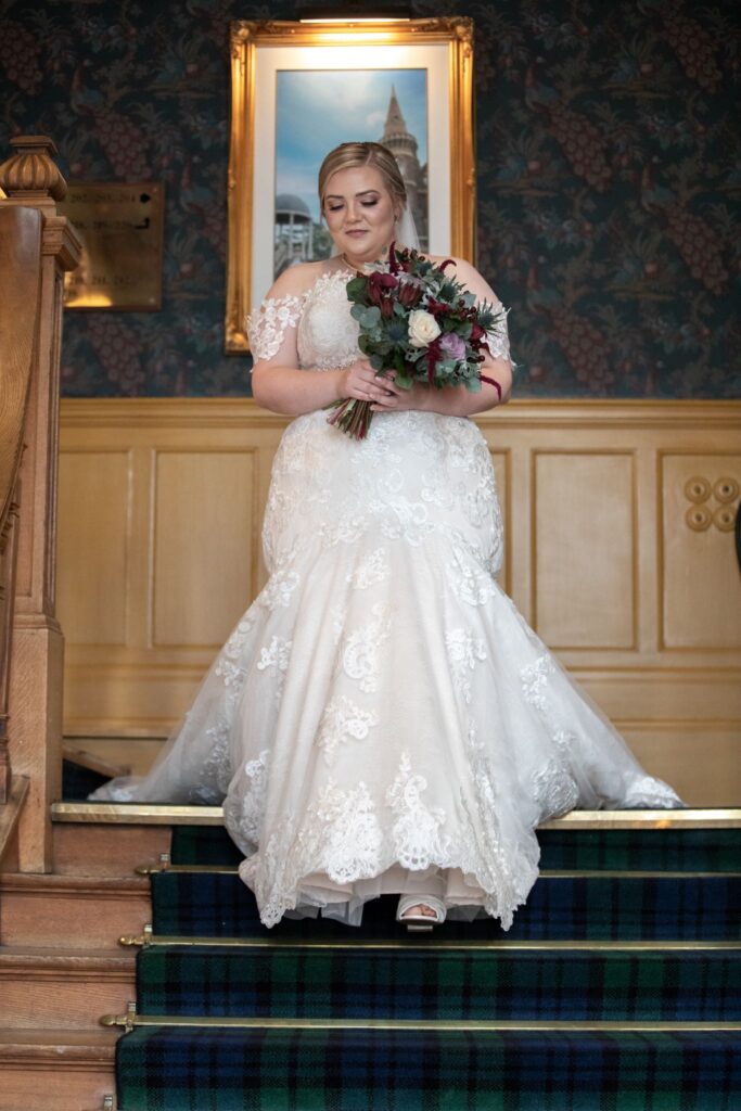 08 bride descends staircase rushpool hall saltburn-by-the-sea oxfordshire wedding photographer
