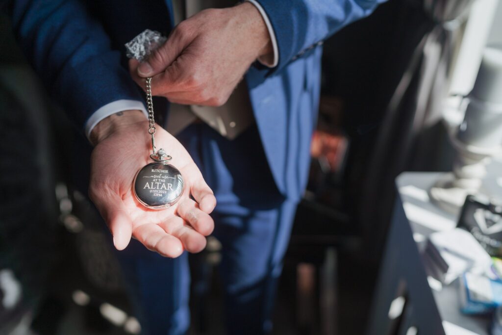 08 groom shows pocket watch grooms preparation oxford oxfordshire wedding photography