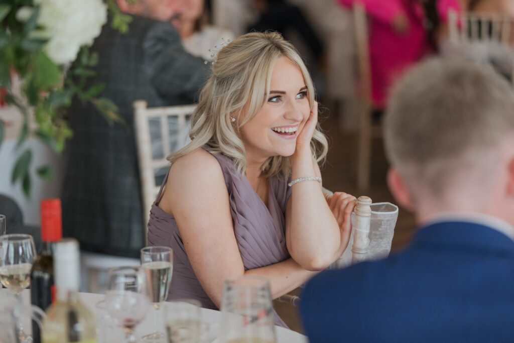 122 laughing bridesmaid hears grooms speech cotswolds hote golf & spa oxfordshire wedding photographers