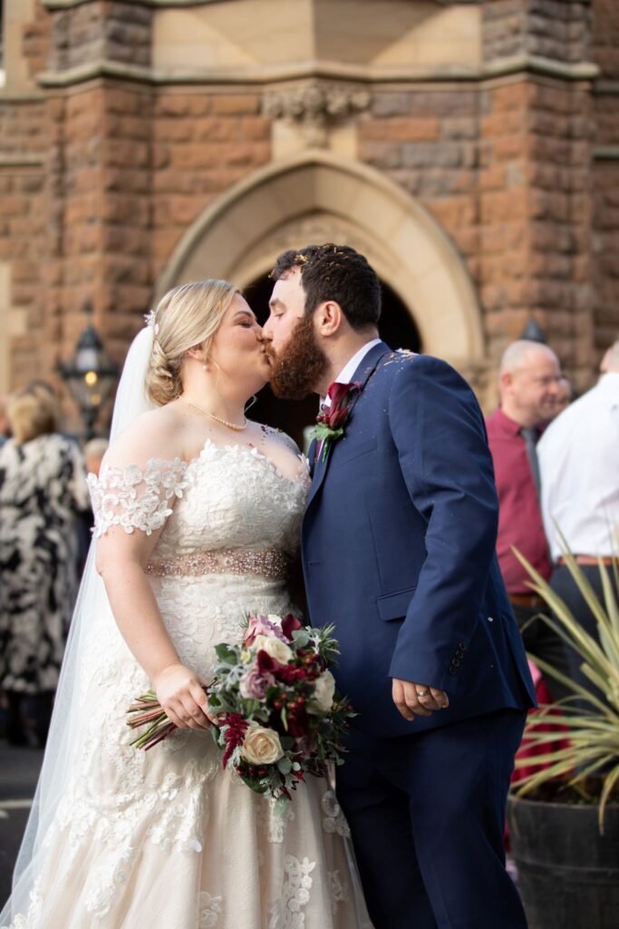 13 bride grooms courtyard kiss rushpool hall saltburn-by-the-sea oxfordshire wedding photographers
