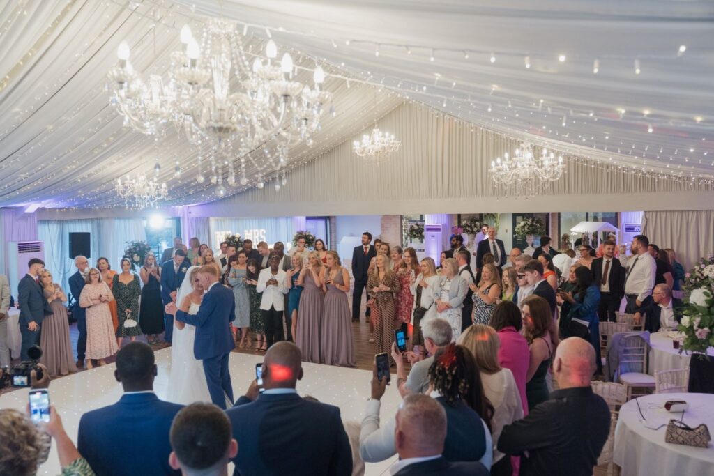 143 guests watch bride grooms first dance cotswolds hotel reception marquee chipping norton oxford wedding photography