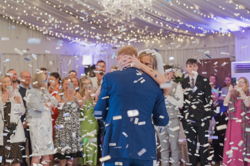 147 bride groom enjoy first dance confetti shower cotswolds hotel marquee chipping norton oxfordshire wedding photographers