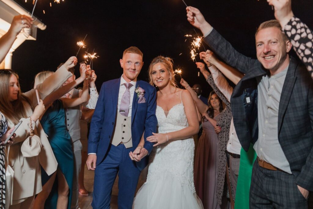 161 guests form sparklers parade cotswolds hotel grounds chipping norton oxfordshire wedding photography