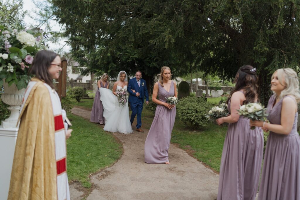 42 bridal party walk through headington quarry parish churchyard oxford oxfordshire wedding photography