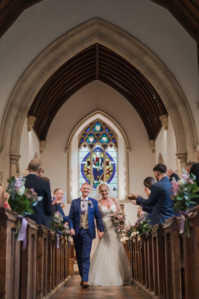 64 bride grooms aisle walk headington quarry parish church oxford oxfordshire wedding photography