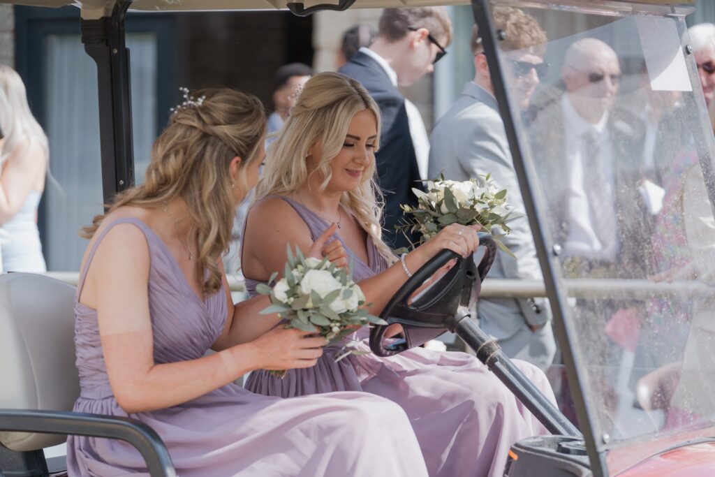 91 bridesmaids hold bouquets cotswolds hotel golf buggy chipping norton oxfordshire wedding photography