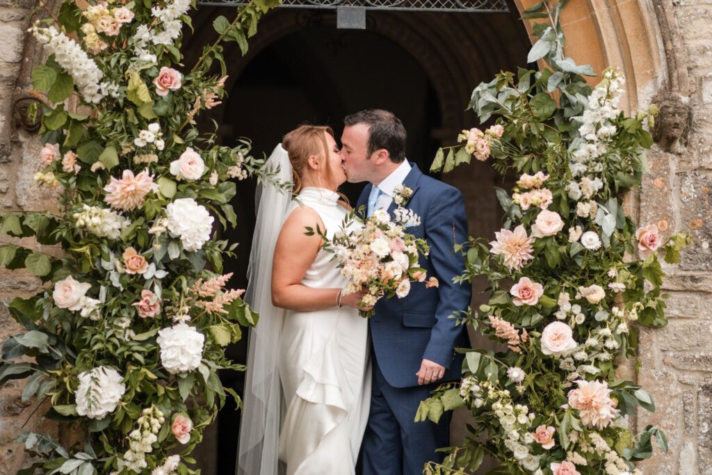 bride groom kiss holy trinity church archway ardington oxford oxfordshire wedding photographer