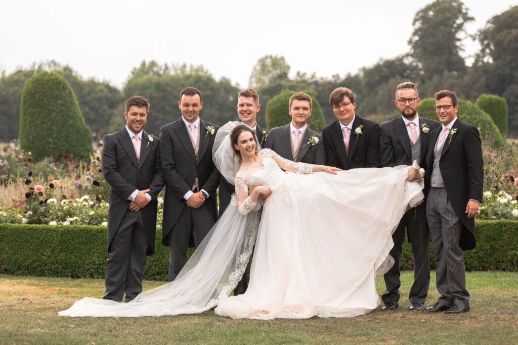 groomsmen lift bride prestwold hall gardens leicestershire oxfordshire wedding photography