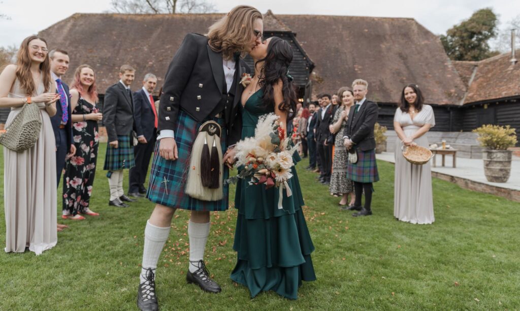 01 bride groom kiss lains barn grounds oxfordshire oxford wedding photographer