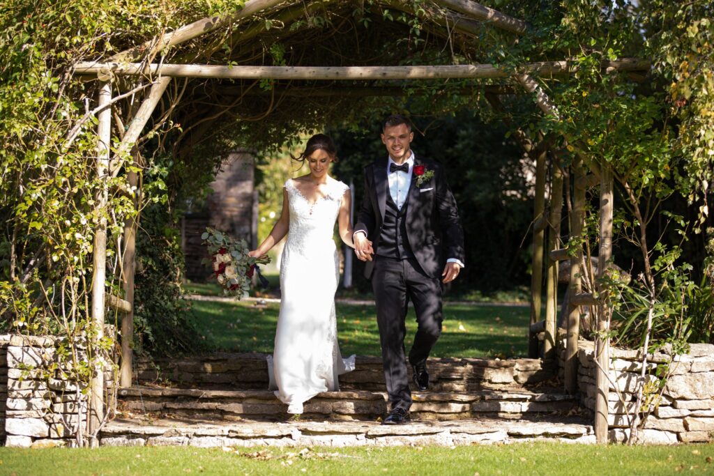 11 bride groom stroll gardens the great tythe barn tetbury gloucestershire oxfordshire wedding photographers