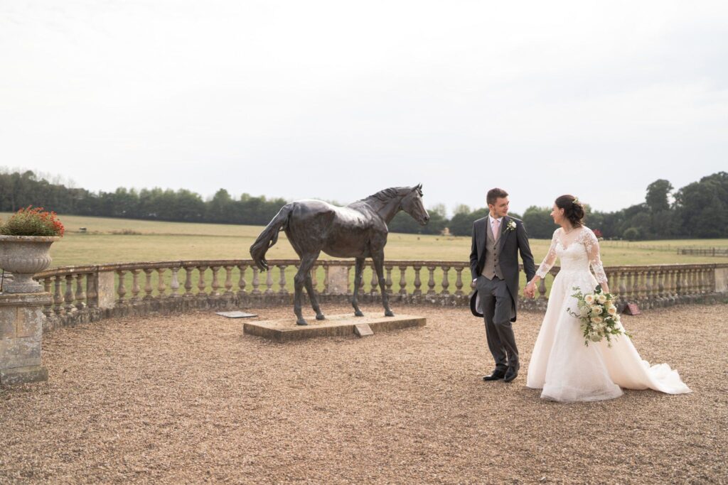 117 bride groom see bronze horse statue prestwold hall grounds loughborough oxfordshire wedding photography