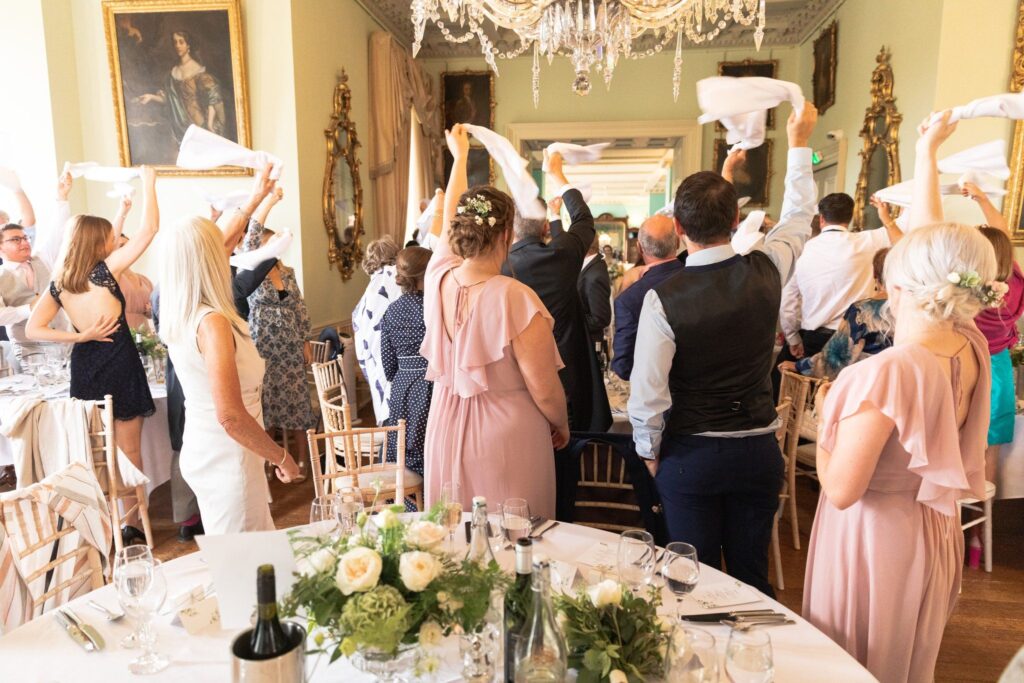 121 guests wave napkins prestwold hall reception leicestershire oxfordshire wedding photographer