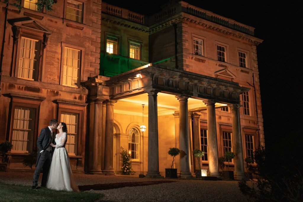 151 bride grooms nightime kiss prestwold hall courtyard leicestershire oxford wedding photographer