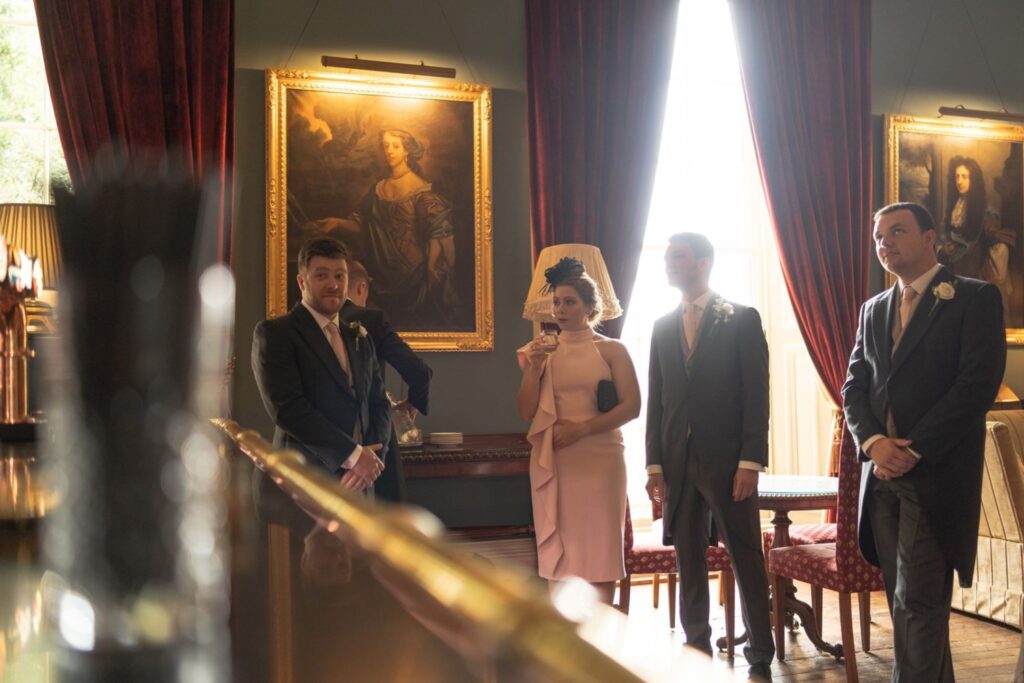34 guests enjoy drinks prestwold hall loughborough oxfordshire wedding photography