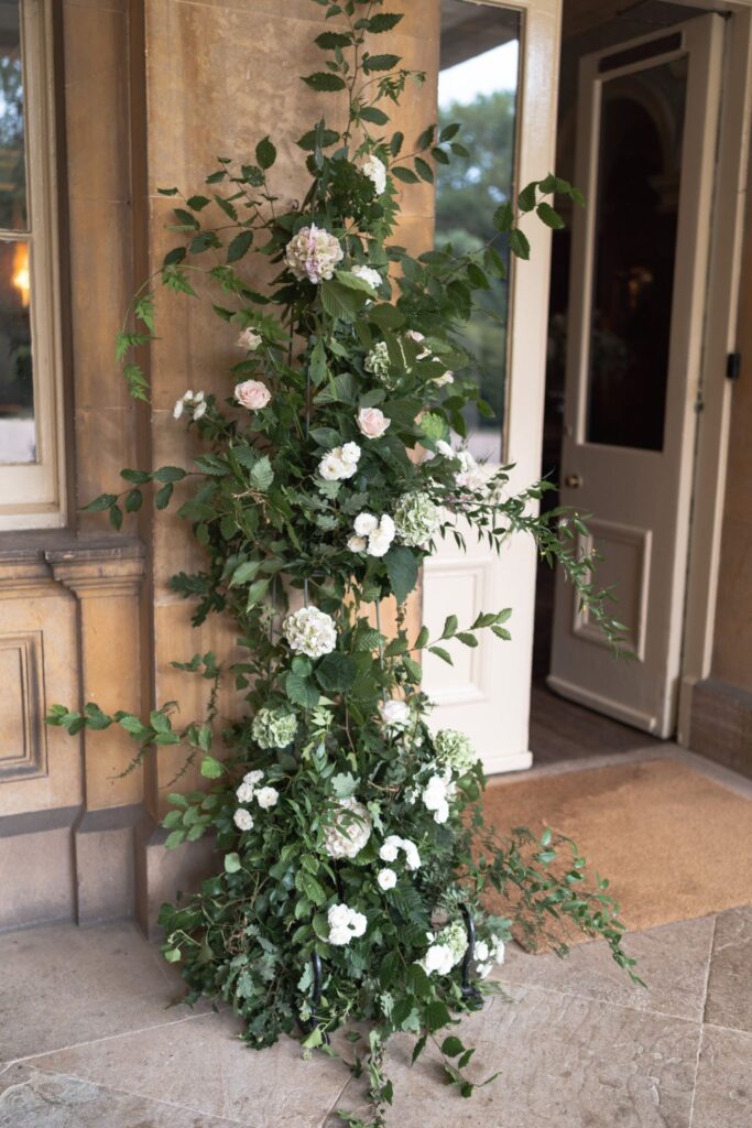 37 floral arrangement prestwold hall entrance doorway loughborough oxford wedding photography