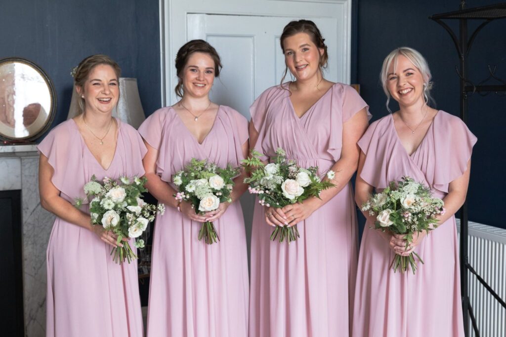 54 bridesmaid hold bouquets bridal prep prestwold hall loughborough leicestershire oxford wedding photographer