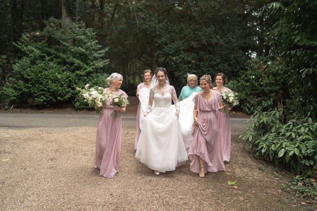 55 bridal party walk towards st andrews church prestwold loughborough oxford wedding photographers