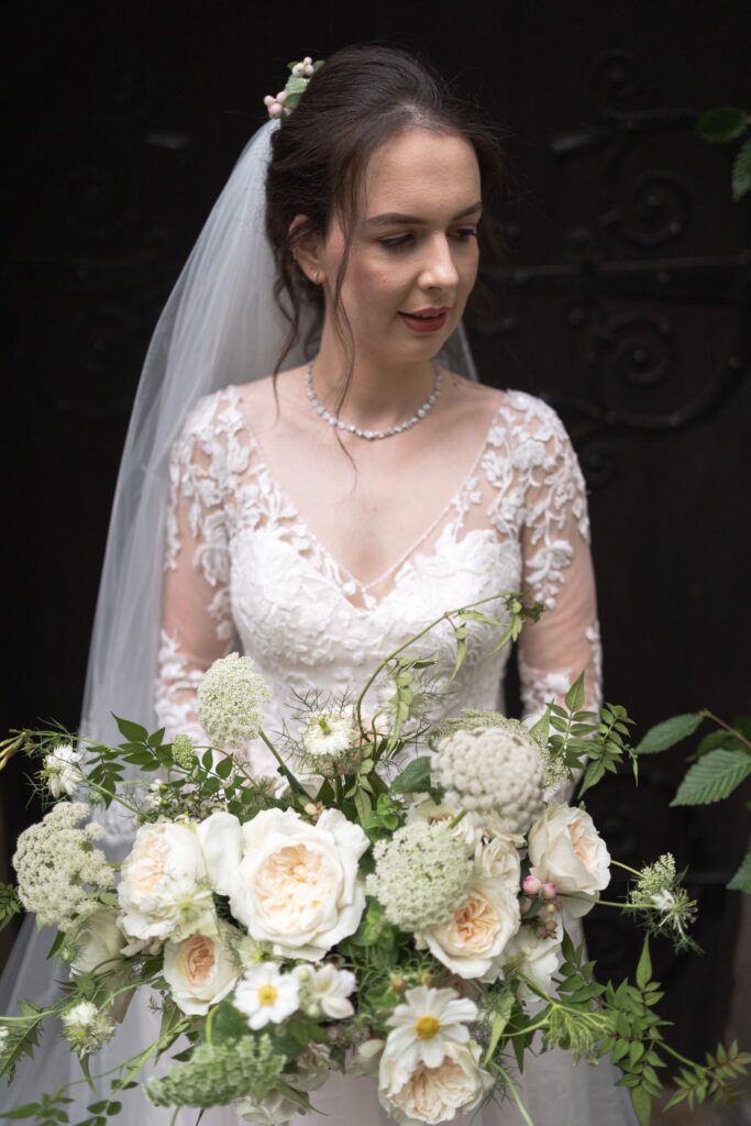 56 bride holds bouquet st andrews churchyard prestwold leicestershire oxford wedding photography