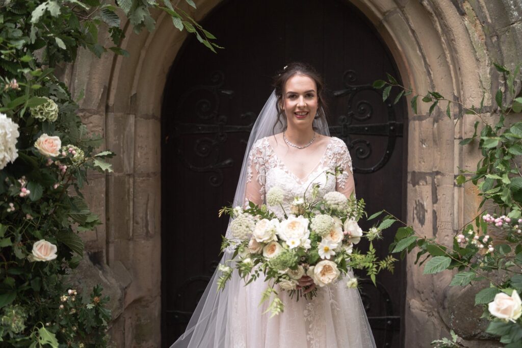 58 brides st andrews church doorway portrait prestwold leicestershire oxfordshire wedding photographers
