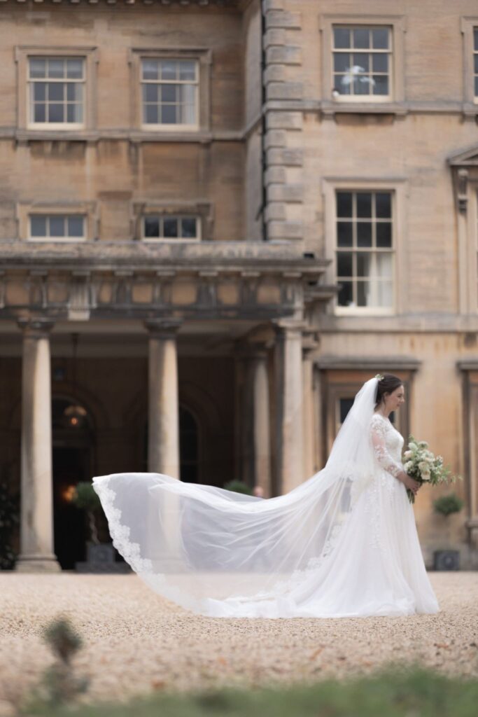 98 brides flowing gown train prestwold hall courtyard loughborough oxford wedding photography
