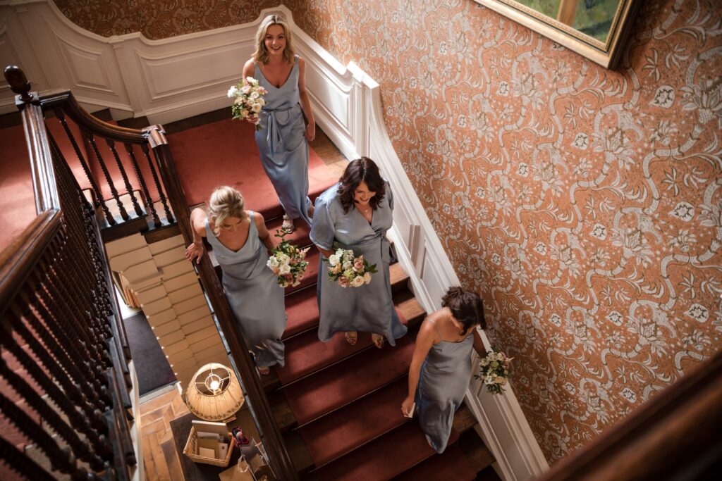 30 bridesmaids descend staircase ardington house wantage oxfordshire oxford wedding photography