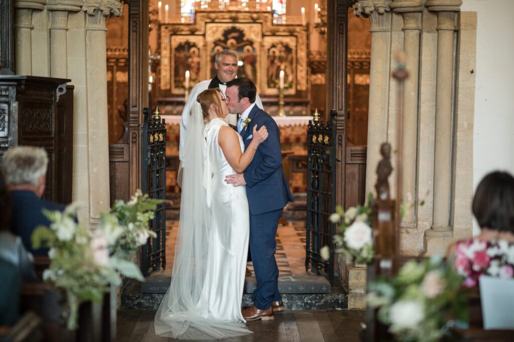 44 bride grooms first kiss holy trinity church ardington wantage oxfordshire oxford wedding photography