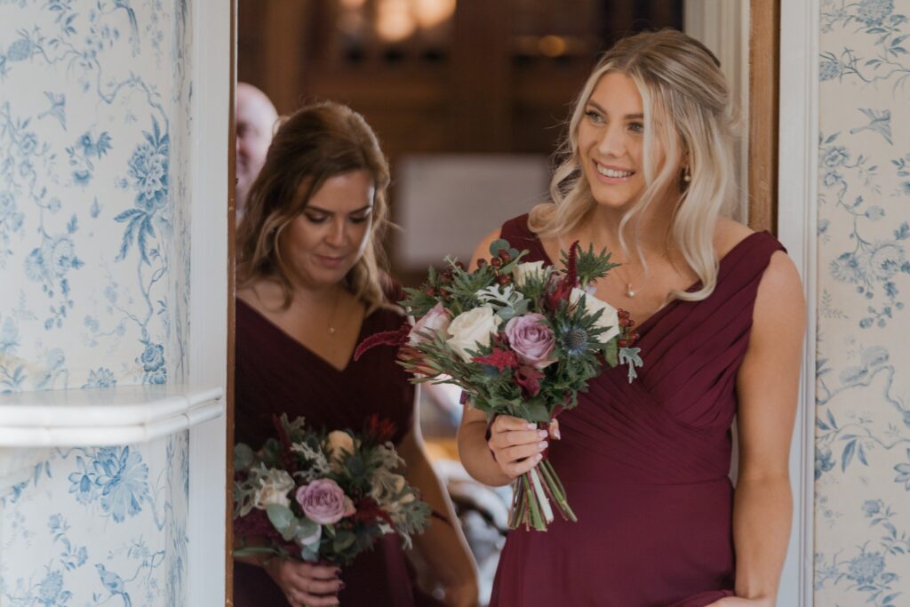 042 smiling bridesmaid carries bouquet marriage ceremony rushpool hall saltburn north yorkshire oxfordshire wedding photography