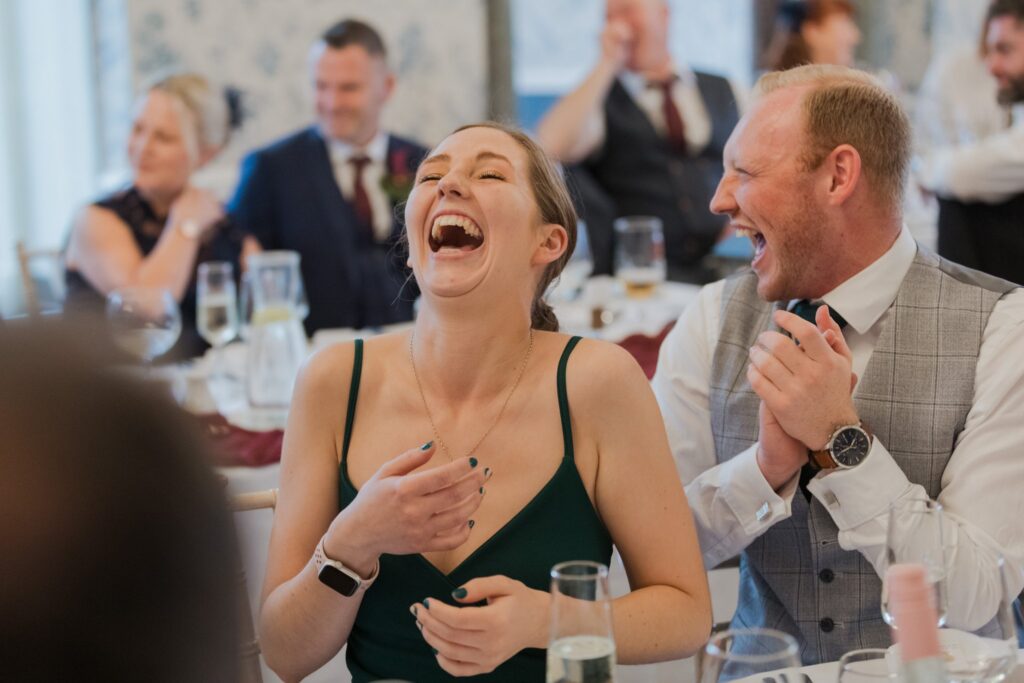068 laughing guests enjoy bestmans reception speech rushpool hall saltburn north yorkshire oxford wedding photographer