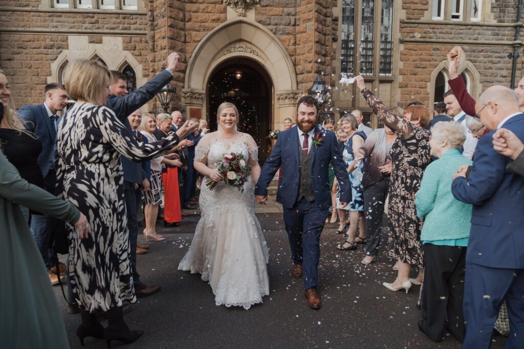 53 bride groom enjoy confetti shower rushpool hall saltburn north yorkshire oxford wedding photography