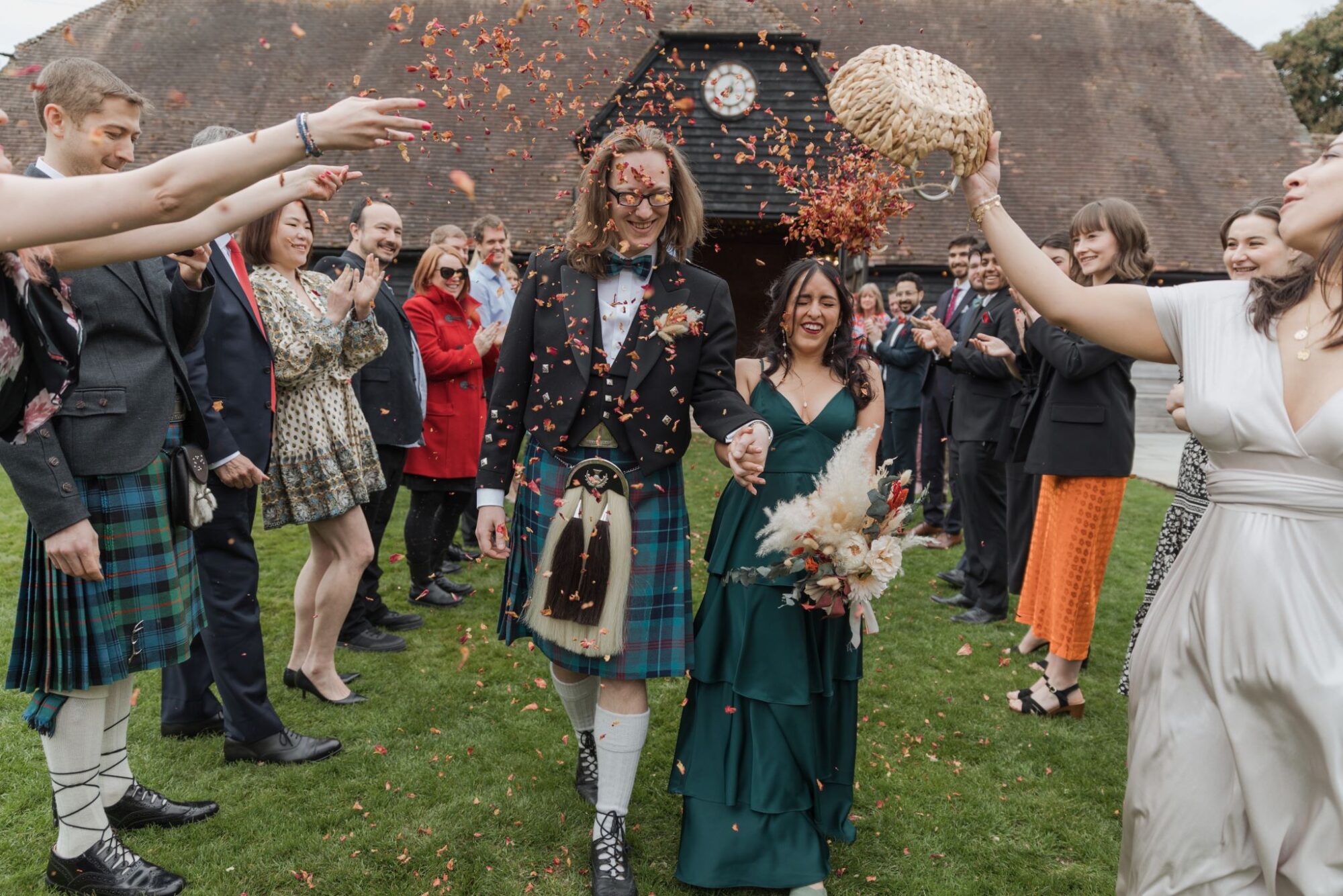03 bride groom enjoy confetti shower lains barn ardington oxfordshire oxford wedding photography